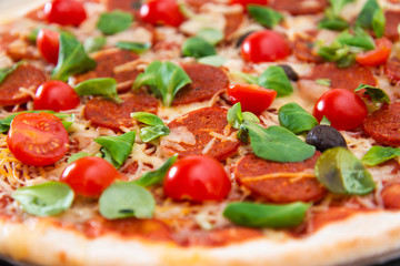 Sausage Pizza with Ham and tomatoes