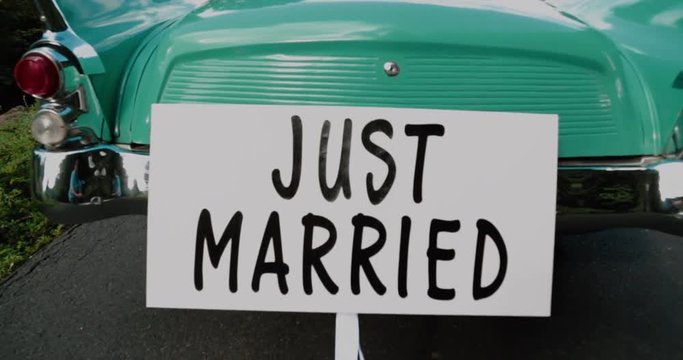 Old time Car with Just Married Sign Cans
