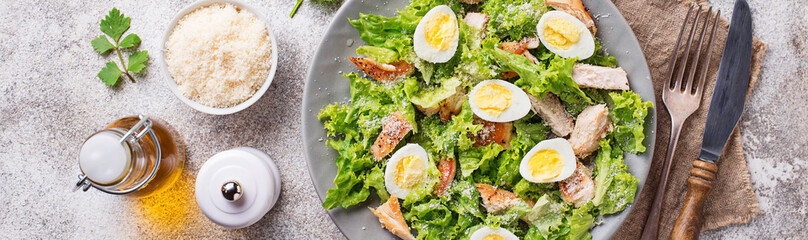 Caesar salad with eggs, chicken and parmesan