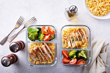 Healthy meal prep containers with chicken, rice and vegetables