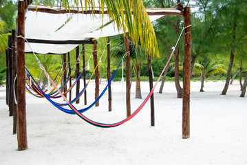 Fototapeta premium Colorful Hammocks waiting for the vacationers. 