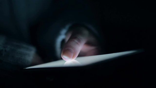 Young girl hold smartphone in night. Close up slow motion 4k footage.