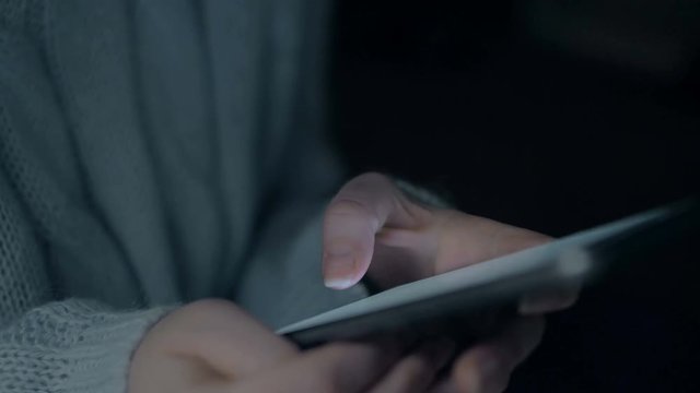 Young girl hold smartphone in night. Close up slow motion 4k footage.