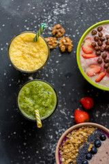 top view shot. blended tasty drink from bananas, pineapples and kiwi. dessert for guests. holiday