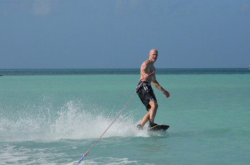 Man Creating a Wake with His Wakeboard in Aruba