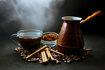 cup of coffee with cinnamon sticks