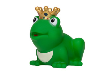 Rubber frog toys. Funny cute rubber green frog king or frog prince toy isolated on a white background. Macro.