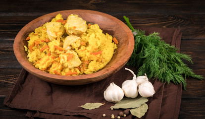 Bowl with boiled rice and meat