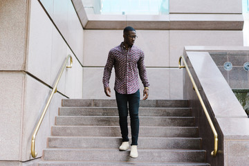 Man walking down the stairs outdoors