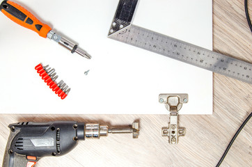 The tool is a drill and a square prepared for marking and inset furniture hinges.