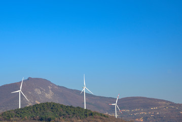 Green energy. Wind turbines for the production of renewable energy. Trentino, Italy