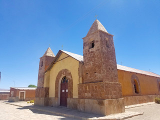 Old church in a village in South America, constructed with clay bricks and mud.