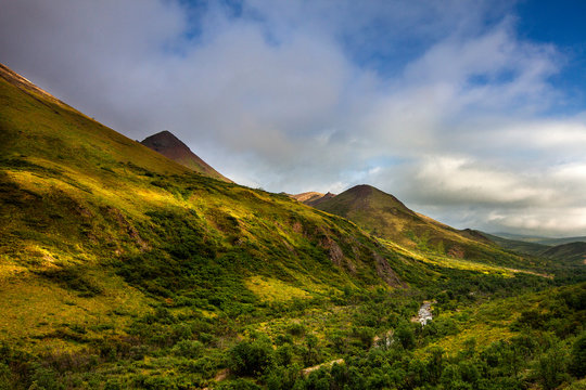 Denali National Park, Alaska: Landscape of clouds and river near Cathedral Mountain.