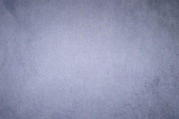 Textured background surface of textile upholstery furniture close-up. Violet Color fabric structure
