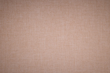 Naklejka na ściany i meble Textured background surface of textile upholstery furniture close-up. beige Color fabric structure
