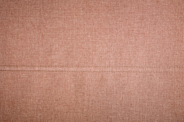 Textured background surface of textile upholstery furniture close-up. burlap brown Color fabric structure
