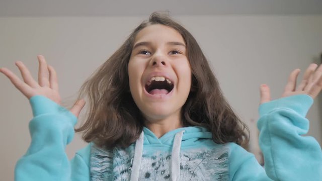 peek a boo. little girl covered her eyes lifestyle face with her hands hide - and - seek waiting for a surprise. slow motion video. teen girl playing bo-peep. childhood concept game hy - spy