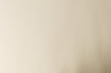 Textured background surface of textile upholstery furniture close-up. leatherette beige color fabric structure