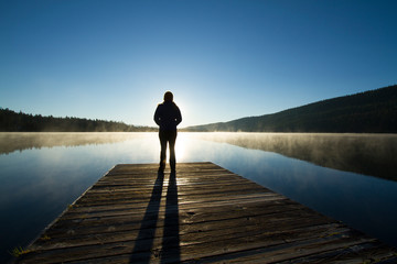Woman on dock on Stanley Lake, Idaho.