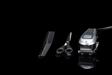 Hair Barber Clippers, Haircut accessories on black mirror background with copy space