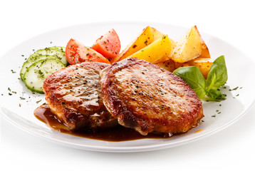 Grilled steak with baked potatoes and vegetable salad