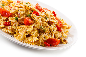 Pasta with vegetables on wooden table