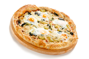 Vegetarian pizza with eggs, zucchini and onion