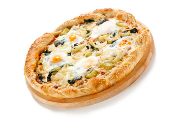 Vegetarian pizza with eggs, zucchini and onion