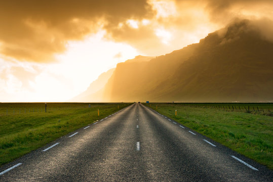 Sunset with highway 1 stretching into the distance in Southern Iceland near the town of Vik.