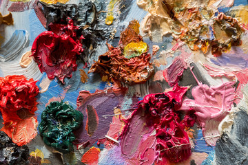 Closeup oil paints on wooden palette
