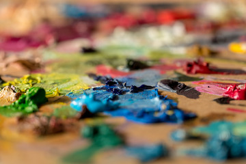 Closeup oil paints on wooden palette