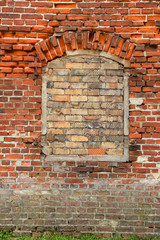 Closed window place with old brick wall