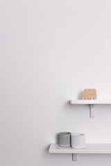 two shelves on a white wall