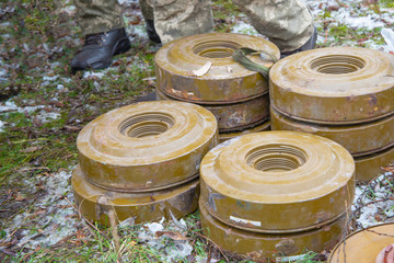 Anti-tank and anti-personnel mines without a fuse lie on the ground.