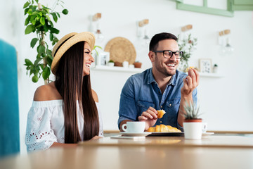 Beautiful couple having coffee on a date,having fun together. - Image