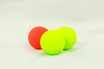 three colored golf balls