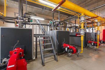 interior of industrial, gas boiler room with boilers; pumps; sensors and a variety of pipelines