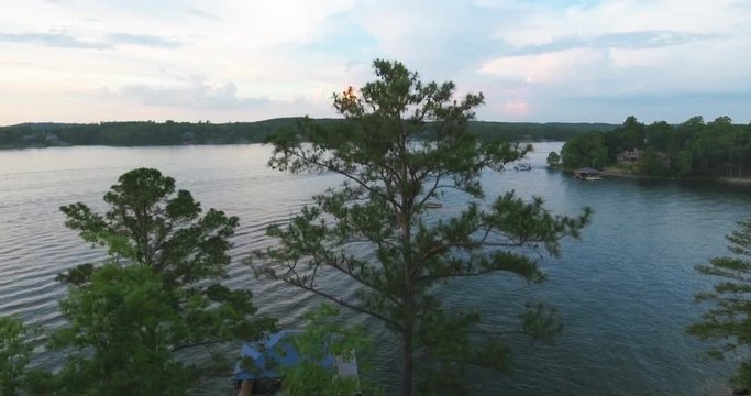 Aerial Flying Straight Up Over Treetops to Reveal Lake in Jasper Alabama