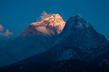 Top of himalayan mountain Ama Dablam (6814 m) at sunset. Nepal