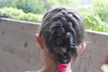 Portrait of hairstyle with braid of young girl