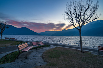 Fototapeta na wymiar Sunset at the embankment of Ascona on Lake Maggiore, Ticino canton of Switzerland