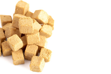 Cube Shaped Doggie Protien Bites on a White Background