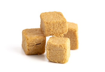 Cube Shaped Doggie Protien Bites on a White Background