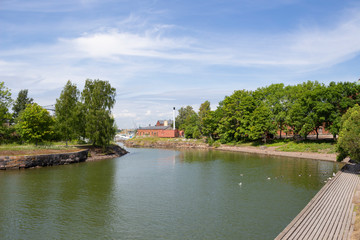 Fototapeta premium Cove at the pier in the historic fortress island Suomenlinna, Sveaborg in the Gulf of Finland in Finland on a summer day.
