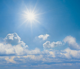 Naklejka na ściany i meble sparkle sun on a cloudy sky background