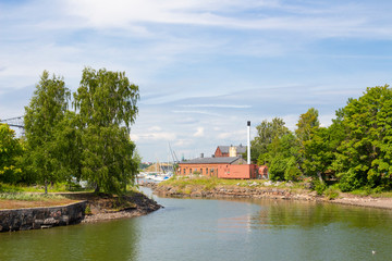 Fototapeta na wymiar Cove at the pier in the historic fortress island Suomenlinna, Sveaborg in the Gulf of Finland in Finland on a summer day.