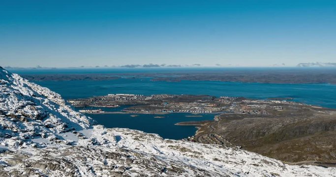 Greenlands capital Nuuk - largest city in Greenland aerial view. Drone video of Nuuk from air, aka Godthaab seen from Mountain Sermitsiaq also showing Nuup Kangerlua fjord.