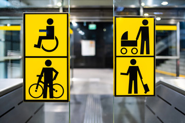 handicapped, bicycle, stroller and big luggage yellow pictrogram in metro, information in public transport, no people