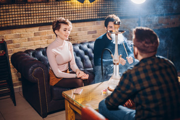 positive young people talking about something. close up shot. friends are in the coffee bar. close up shot. entertainment
