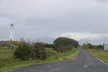 Road, mountains and lighthouse
